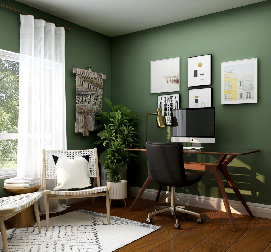 Home office with green wall and plants