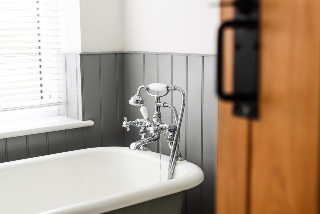 Bath tub in a gray bathroom