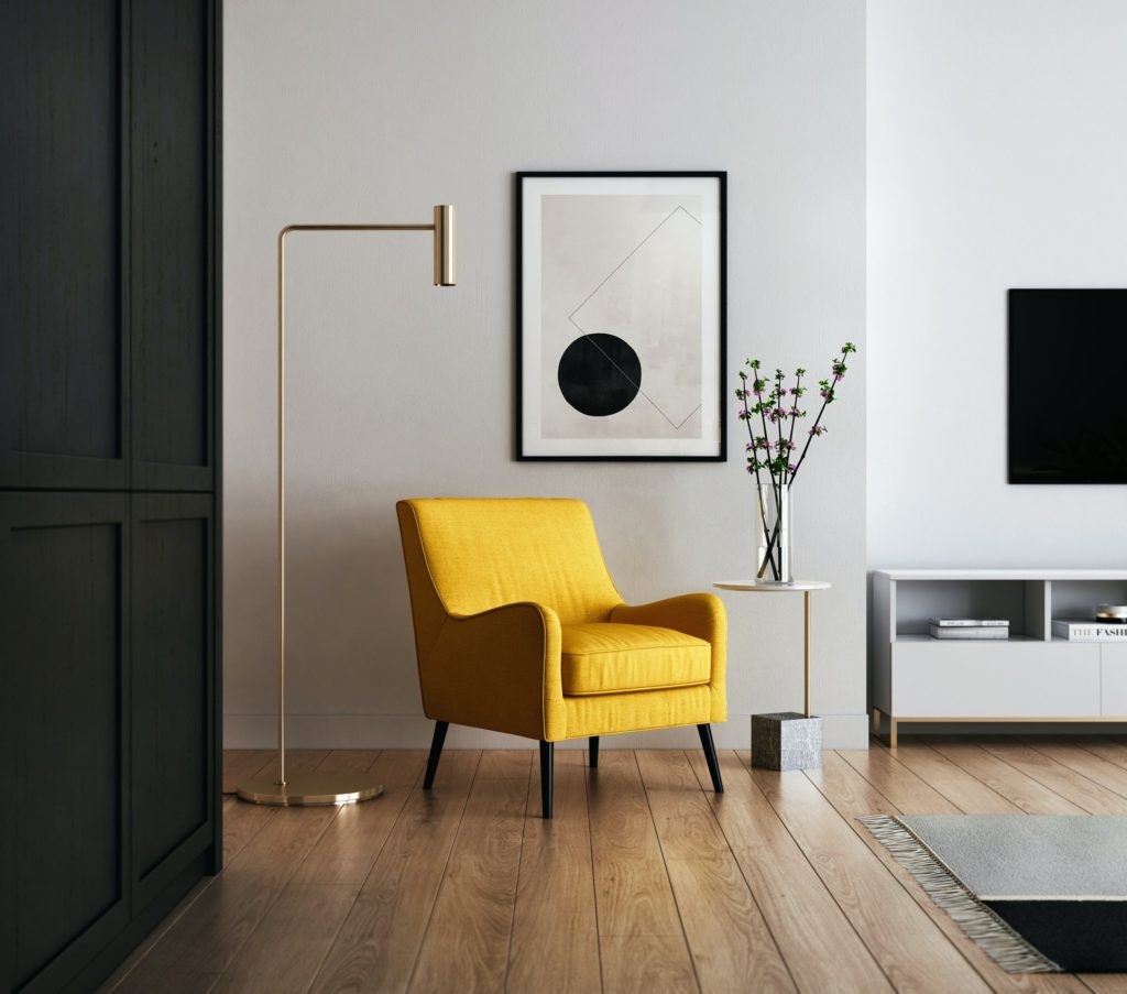 Minimalist modern living room with a yellow accent chair