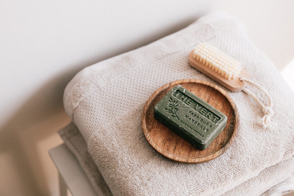 Towels, soap, and bath brush