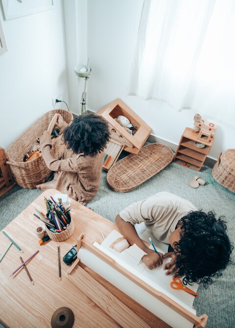 Children using wicker baskets to organize things.