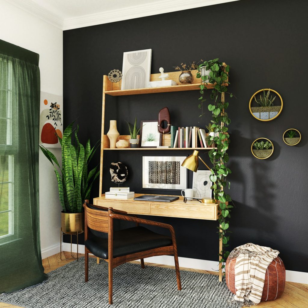 home office with black dark walls and plants 