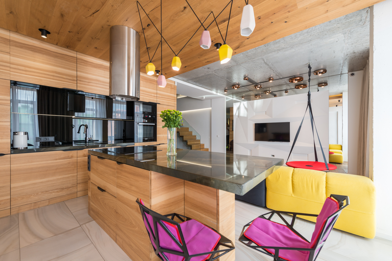 Colorful kitchen yellow and pink pendant lights.