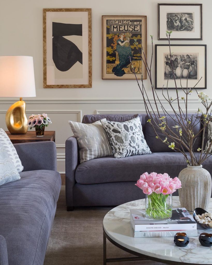 Nice apartment living room with gray sofa and marble table with décor