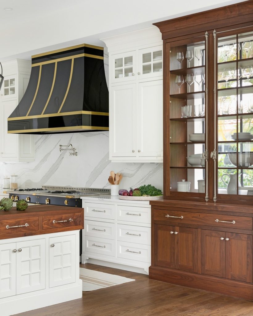 Black hood in a wooden and white kitchen