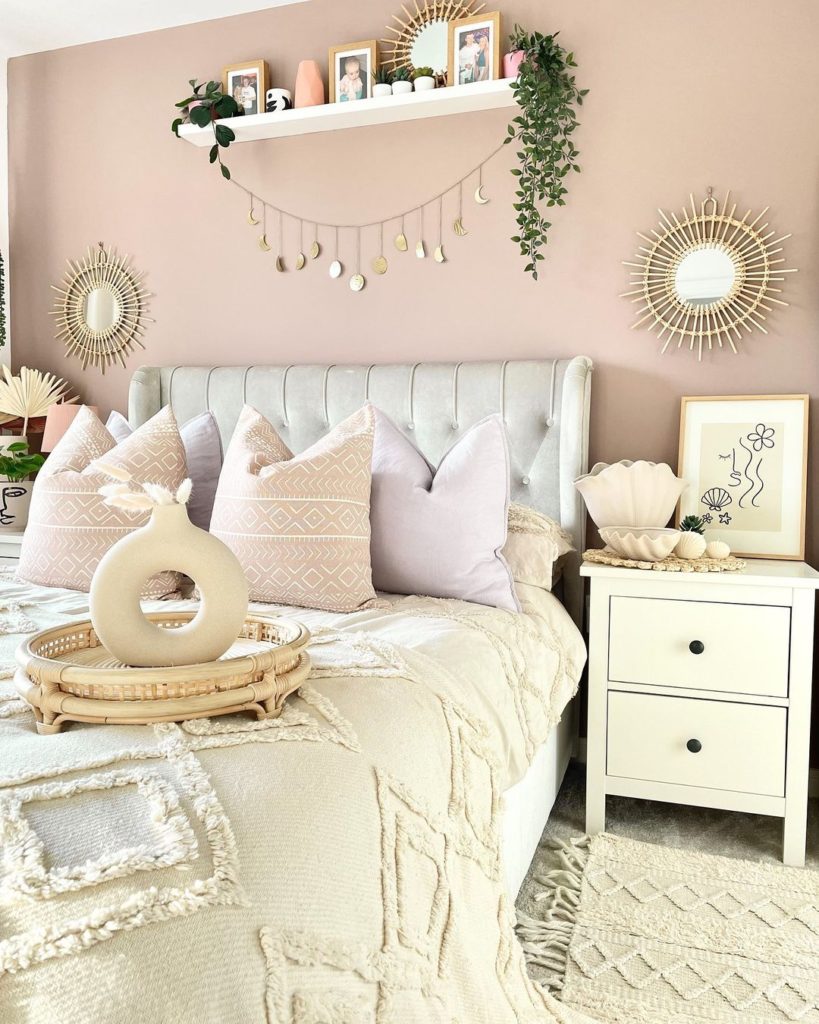 A pretty, soft, and feminine boho bedroom.