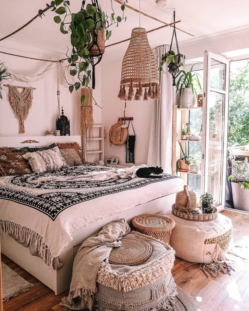 Neutral boho bedroom with natural elements like wood and wicker.