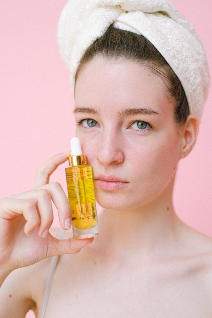 Lady holding skincare product