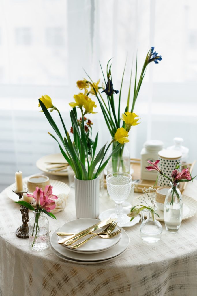 Table with eating utensils and glassware