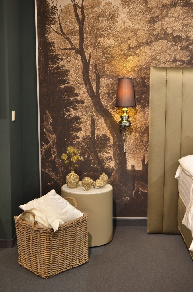 Wicker basket in a green bedroom