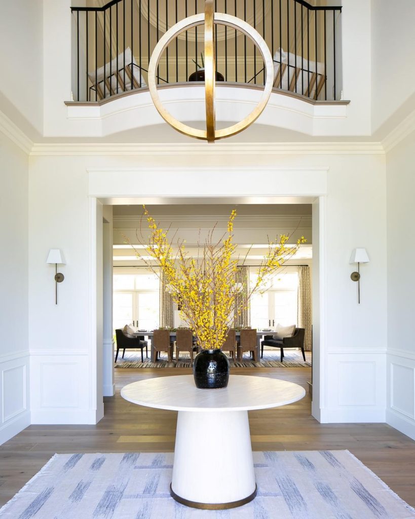 An entryway with a large round table.